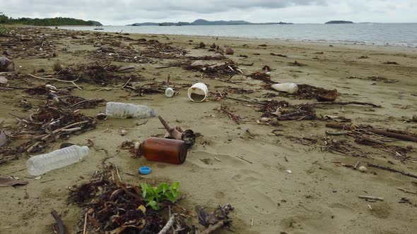 A Beach is Polluted with Plastic and Waste