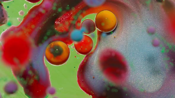 Bubbles Float in Liquid Paint Mixing Ink Oil and Milk Abstract Multicolor Hypnotic Painting