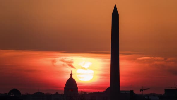 Timelapse of the the sun rising behind the Capitol Building and the Washington Monument in Washingto