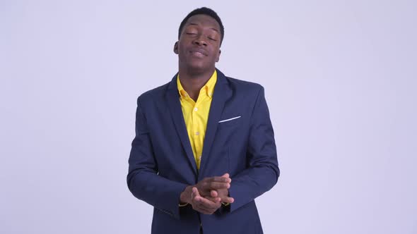 Young Happy African Businessman Looking Excited While Talking