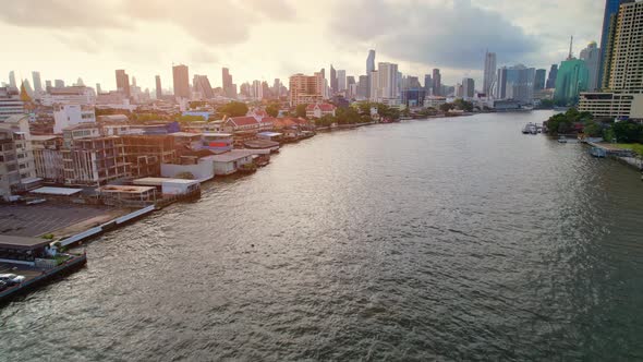 4K UHD : Aerial view over the Chao Phraya River and Buildings