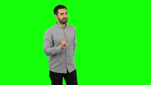 Brunette Guy Is Giving a Gift, Small Box with a Surprise. Green Screen