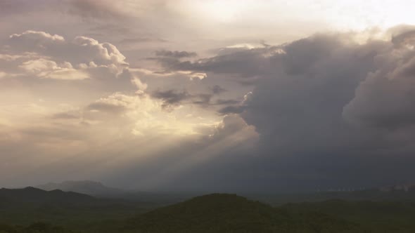 Rain storms and black clouds moving over the mountains.