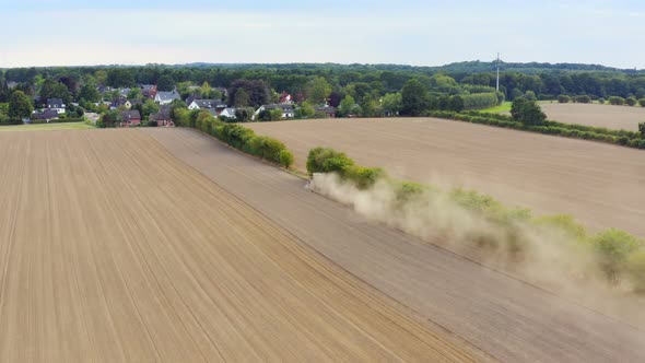 Aerial view of an agriculture field with tractor