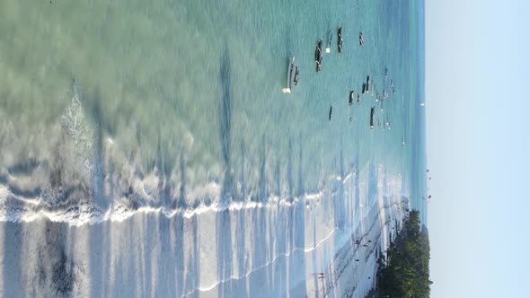 Tanzania Vertical Video  Boat Boats in the Ocean Near the Coast of Zanzibar Aerial View