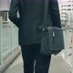 Asian businessman casual dress carrying a shoulder bag while walking in the street. - VideoHive Item for Sale