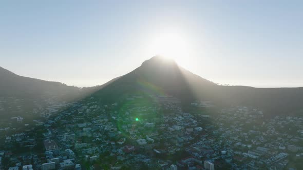 Aerial Descending Shot of Lions Head Mountain Casting Shadow Residential Borough