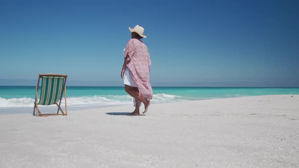 Senior woman walking at the beach