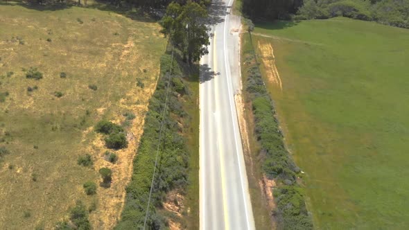 Aerial view of endless asphalt road leading to Big Sur, California