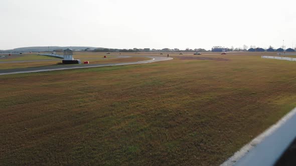 Four Cars Compete on the Race Track