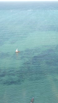 Vertical Video Boats in the Ocean Near the Coast of Zanzibar Tanzania