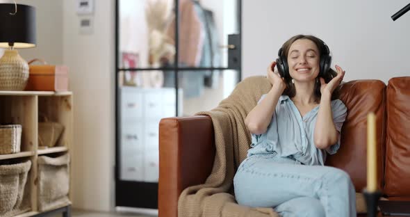 Woman Enjoying Music at Home