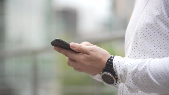 Closeup of a Man Texting on the Phone and He Has an Emotion of Disappointment