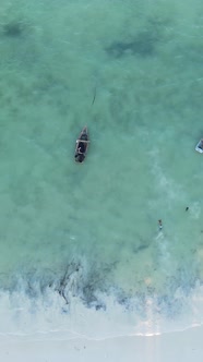 Vertical Video Boats in the Ocean Near the Coast of Zanzibar Tanzania