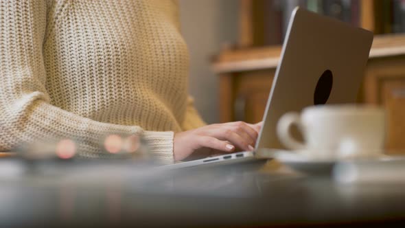 Woman Typing On Laptop Computer