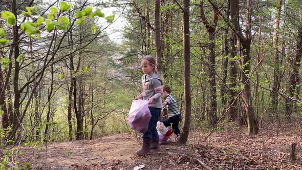 Preschool Children Holding Garbage Bag Full with Plastic Trash Outdoor