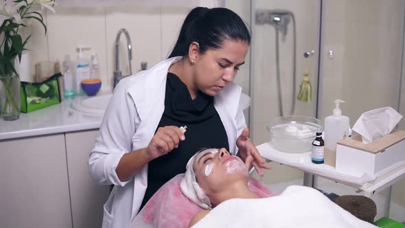 Professional Skin Care for Young Woman in Spa Salon