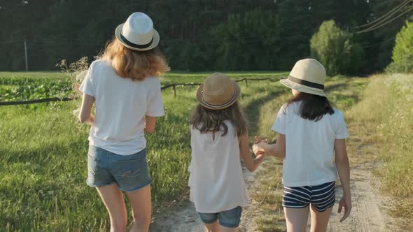 Children Walking Back Along Country Road Turn Their Faces To Look Surprised