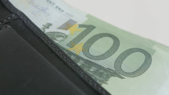 Euro paper money in bi-fold leather case 3840X2160 UltraHD tilting footage - Modern black wallet ful
