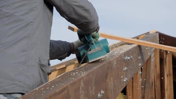 Planing a Tree with an Electric Planer.