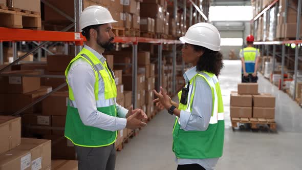 Warehouse Supervisors Shaking Hands During Meeting