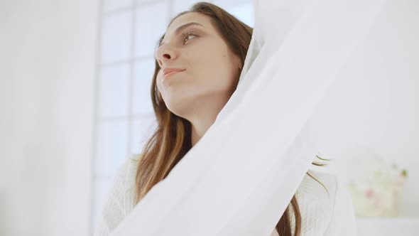 Young Beautiful Girl in White Decor