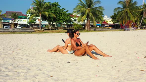 Girls look beautiful on perfect tourist beach time by clear ocean and white sand background of Thail