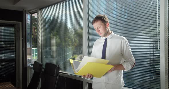 Smiling Caucasian Men Intern Standing at Modern Office Coworking Space