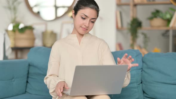 Indian Woman Coming Back Opening Laptop From Sofa 