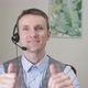 Young Businessman Communicates By Video Link Smiles and Raises His Thumbs Up - VideoHive Item for Sale