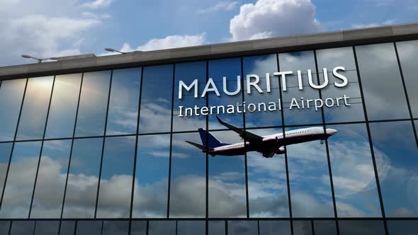 Airplane landing at Mauritius airport mirrored in terminal