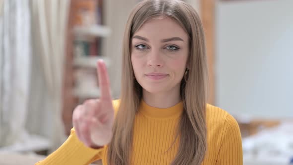 Portrait of Attractive Young Woman Saying No By Finger