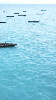 Boat Boats in the Ocean Near the Coast of Zanzibar Tanzania Slow Motion Vertical Video