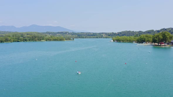 Sweeping aerial view of the stunning lake banyoles in the catalan countryside of spain.