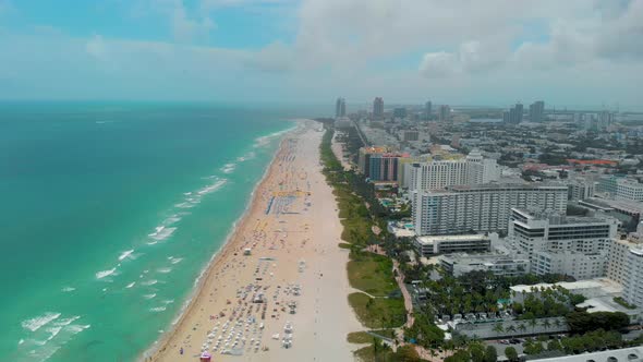 Miami South Beach Sunrise with Lifeguard Tower and Coastline with Colorful Cloud and Blue Sky South