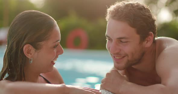 Woman and Man Smiling Near Swimming Pool Water