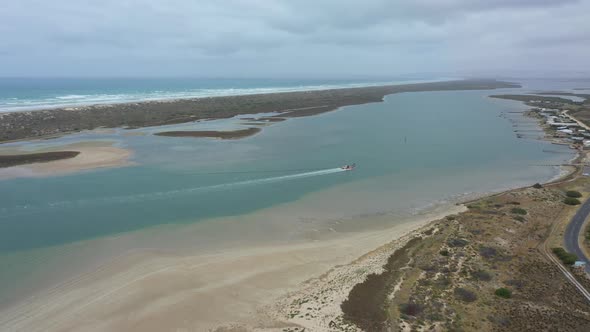 Aerial footage of a sand dredger at the mouth of the River Murray in regional Australia