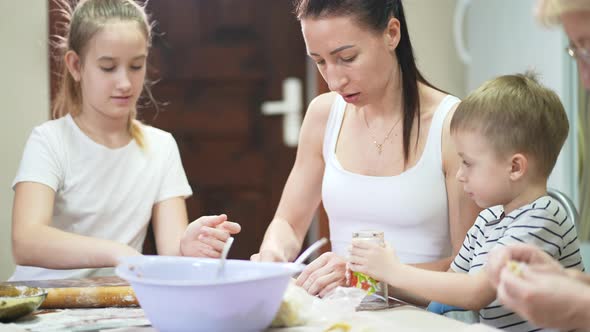 Family Cooking in Kitchen