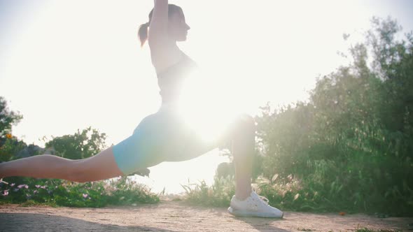 Sportive Woman Doing Stretching Outdoors