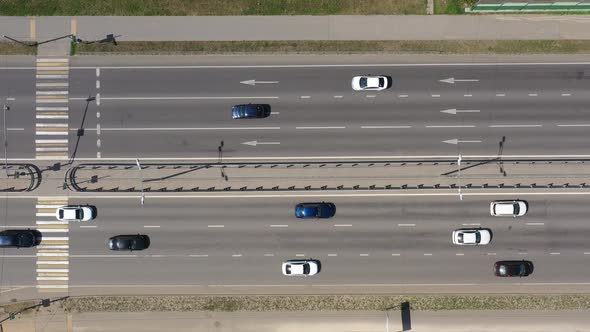 Overhead View of Black and White Cars Moving Along the Multilane Highway