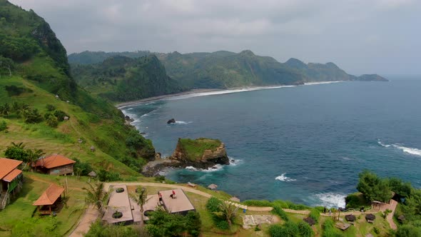 Paradise landscape of Javanese coast near Menganti Beach Indonesia, aerial dolly