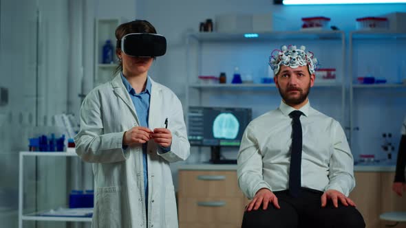 Neurological Scientist Using Medical Inovation in Lab Wearing VR Glasses