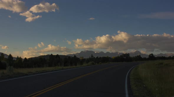 Beautiful white clouds rolling over the Ridgeway State Park in Colorado Sunrise -Time lapse