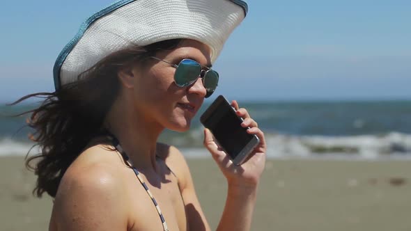 Beautiful Woman Smiling, Dialing Number, Talking on Phone, Ending Call on Beach