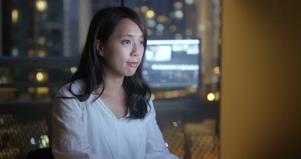 Woman work on computer at night