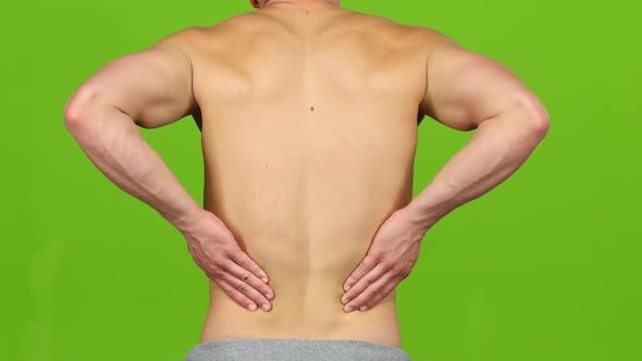 Man Suffering From Backache Painful Cramps, Severe Back Pain