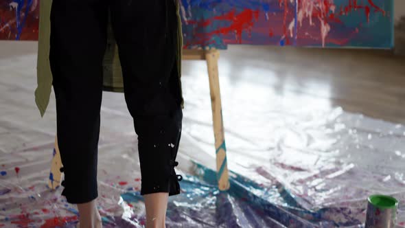 Blonde Woman Reflecting in Front Her Artwork in Workshop Rare View