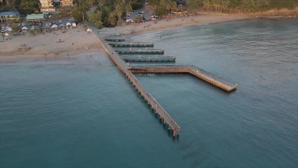 Travelers enjoying vacation on sandy beach on seashore