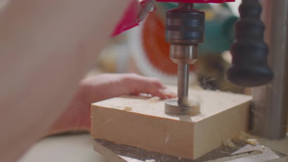 Carpenter Drilling Wood with Hole Saw