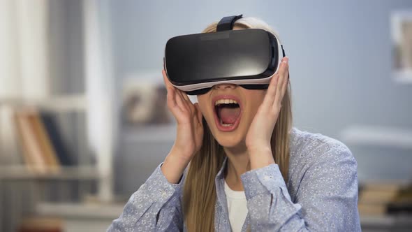 Excited Female Gamer Looking Around in Virtual Reality Glasses, Innovation